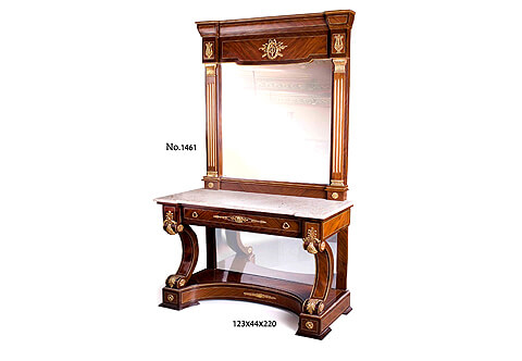 A handsome grand mid 19th century Neo-Classical style ormolu-mounted veneer inlaid mirrored console table with matching mirror, The grand trumeau form wooden beveled mirror frame sans traverse veneer and filet inlaid surmounted with a recessed Entablature top ornamented with ormolu foliate ribbon tied berried laurel wreath and arrows and ormolu lyre mount on each side, Flanked at each side with a Doric style pilasters with fluted shafts and ormolu capital and base above a protruded base with ormolu rosettes, The mirror is resting on a marble top above the shaped veneer inlaid apron with a large drawer ornamented with a central typical Neo-classical style cartouche and palmette ormolu mount, sided with blocks decorated with leafy palmettes, The console is raised on a solid platform base with mirror back plate supported by C scrolled voluted robust legs accented with ormolu acanthus leaves and ormolu rosettes  and a curved recessed blinth ornate with ormolu laurel branch and sit on beveled shaped flattened legs